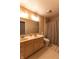 Bright bathroom featuring double sinks, a spacious layout, and shower at 1884 Misty Lake Dr, Indianapolis, IN 46260