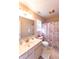 Cozy bathroom featuring a vanity with ample lighting and a seashell-themed shower curtain at 1884 Misty Lake Dr, Indianapolis, IN 46260