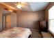 Inviting bedroom with neutral tones, soft lighting, and cozy carpet at 1884 Misty Lake Dr, Indianapolis, IN 46260