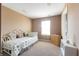 Cozy bedroom with a daybed, natural light, and soft carpet at 1884 Misty Lake Dr, Indianapolis, IN 46260