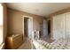 Comfortable bedroom with beige carpet, a double closet, and an ensuite bathroom at 1884 Misty Lake Dr, Indianapolis, IN 46260