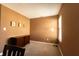 Carpeted bedroom with warm brown walls, natural light, and wooden desk at 1884 Misty Lake Dr, Indianapolis, IN 46260