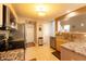 Well-lit kitchen with granite countertops, stainless steel appliances, and a convenient pantry at 1884 Misty Lake Dr, Indianapolis, IN 46260
