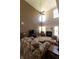 Bright living room with soaring ceilings, neutral paint, plush carpet, and a cozy fireplace at 1884 Misty Lake Dr, Indianapolis, IN 46260