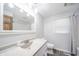 Bright bathroom featuring a stone countertop, large mirror, and shower-tub combo at 1908 Roundhill Dr, Anderson, IN 46013