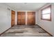Bedroom featuring hardwood floors, neutral walls, and plenty of natural light at 1908 Roundhill Dr, Anderson, IN 46013