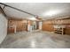 Spacious garage with ample storage, work area, and convenient access to utilities at 1908 Roundhill Dr, Anderson, IN 46013