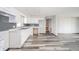 Open kitchen with white cabinets, marble countertops, and gray subway tile backsplash at 1908 Roundhill Dr, Anderson, IN 46013