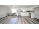 Bright kitchen with white cabinetry, modern appliances, and a cozy dining area at 1908 Roundhill Dr, Anderson, IN 46013