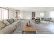 Cozy living room with hardwood floors, ample seating, and bright natural light at 1908 Roundhill Dr, Anderson, IN 46013