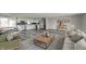 Open-concept living area with hardwood floors, neutral decor, and an abundance of natural light at 1908 Roundhill Dr, Anderson, IN 46013