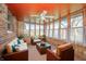 Bright and airy sunroom with plenty of seating and natural light at 1908 Roundhill Dr, Anderson, IN 46013