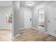 Inviting entryway with wood-look flooring, neutral walls, and views to adjacent rooms at 19516 Golden Meadow Way, Noblesville, IN 46060