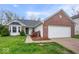 Charming single-story home with brick and vinyl siding and an attached two-car garage at 19516 Golden Meadow Way, Noblesville, IN 46060