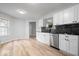 Open kitchen design with wood-look floors, stainless appliances, and ample cabinet space at 19516 Golden Meadow Way, Noblesville, IN 46060