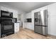Bright, updated kitchen with stainless steel appliances and view to laundry room at 19516 Golden Meadow Way, Noblesville, IN 46060