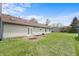 View of the backyard with ample lawn space, a concrete patio, and exterior storage shed at 2102 Coldwater Cir, Indianapolis, IN 46239