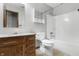Bathroom featuring a granite countertop, a shower-tub combo, and a wooden vanity at 2102 Coldwater Cir, Indianapolis, IN 46239