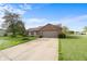 Charming single-story home featuring a brick accent wall, attached garage and a driveway at 2102 Coldwater Cir, Indianapolis, IN 46239