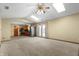 A spacious living room featuring carpet floors, neutral colors and an open floor plan to the kitchen at 2102 Coldwater Cir, Indianapolis, IN 46239