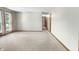 A bright living room offers natural light with carpet floors and neutral paint at 2102 Coldwater Cir, Indianapolis, IN 46239