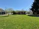 Charming single story home with a well-manicured lawn and inviting curb appeal at 2143 N Graham Ave, Indianapolis, IN 46218