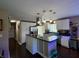 Well-equipped kitchen with island, stainless steel appliances, and plenty of storage space at 2143 N Graham Ave, Indianapolis, IN 46218
