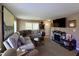 Cozy living room featuring a fireplace and comfortable seating for relaxation at 2143 N Graham Ave, Indianapolis, IN 46218