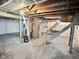 Unfinished basement with concrete floor, exposed ceiling, and utilitarian features at 2309 Pennsylvania St, Columbus, IN 47201