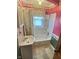 Bathroom with a tub, shower, sink, vanity, and linoleum flooring at 2309 Pennsylvania St, Columbus, IN 47201