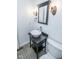 Bathroom featuring a vanity with vessel sink, stylish mirror, and modern fixtures at 233 N Fenton Ave, Indianapolis, IN 46219