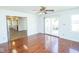 Open dining room featuring hardwood floors, access to a deck, and neutral paint at 233 N Fenton Ave, Indianapolis, IN 46219