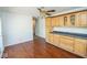Open dining room with hardwood floors, custom cabinets, and neutral paint at 233 N Fenton Ave, Indianapolis, IN 46219