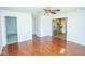 Open living room featuring hardwood floors and neutral paint at 233 N Fenton Ave, Indianapolis, IN 46219