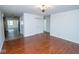 Open-concept living area with hardwood floors flows seamlessly, connecting multiple spaces within the home at 233 N Fenton Ave, Indianapolis, IN 46219