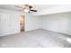 Spacious primary bedroom with plush carpet and an ensuite bathroom at 233 N Fenton Ave, Indianapolis, IN 46219