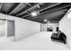 Unfinished basement featuring painted ceiling beams and walls, with plenty of potential for customization at 2333 Calhoun St, Indianapolis, IN 46203