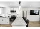Updated kitchen with white cabinets, granite countertops, and bar seating at 2333 Calhoun St, Indianapolis, IN 46203