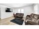 Comfortable living room with dual sofas, a mounted TV, and natural light at 2333 Calhoun St, Indianapolis, IN 46203