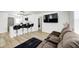Bright living area with modern decor, featuring bar seating, a TV, and cozy furniture at 2333 Calhoun St, Indianapolis, IN 46203