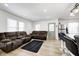 Open-concept living room with hardwood floors, large windows, and comfortable seating at 2333 Calhoun St, Indianapolis, IN 46203