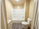 Bright bathroom featuring a shower-tub combo and neutral finishes at 274 Leeds Ave, Indianapolis, IN 46201
