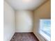 Compact bedroom featuring a window and carpeted flooring at 274 Leeds Ave, Indianapolis, IN 46201