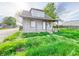 Quaint two-story home featuring a cozy front porch and fresh exterior paint at 274 Leeds Ave, Indianapolis, IN 46201