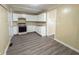 Cozy kitchen features white cabinets and hard surface floors at 274 Leeds Ave, Indianapolis, IN 46201