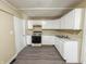 Bright kitchen features ample white cabinets and updated countertops at 274 Leeds Ave, Indianapolis, IN 46201