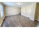 Clean and modern living room with updated floors, neutral paint, and bright window at 274 Leeds Ave, Indianapolis, IN 46201