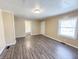 Spacious living room with updated floors, neutral paint, and convenient layout at 274 Leeds Ave, Indianapolis, IN 46201