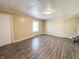 Bright living room featuring updated floors, fresh paint, and natural light at 274 Leeds Ave, Indianapolis, IN 46201