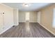 Neutral living room with hard surface floors and freshly painted walls at 274 Leeds Ave, Indianapolis, IN 46201